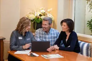Renewal by Andersen design consultant working alongside couple. DIY Window Replacement
