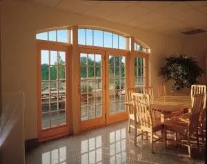 Interior view of home with marble flooring and French hinged patio doors.