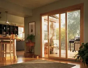 Patio Doors Green Bay WI Interior of single family home featuring wood flooring, an organized kitchen, and sliding French patio doors that lead to a deck.