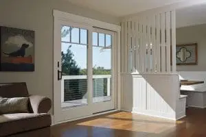Frenchwood patio door separating interior and outdoor living area of home.