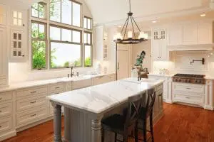 Well-organized kitchen with new replacement windows above the sink