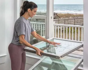 woman using spring cleaning checklist
